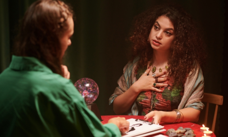 Astrologer studying zodiac signs and star charts for divine insights.